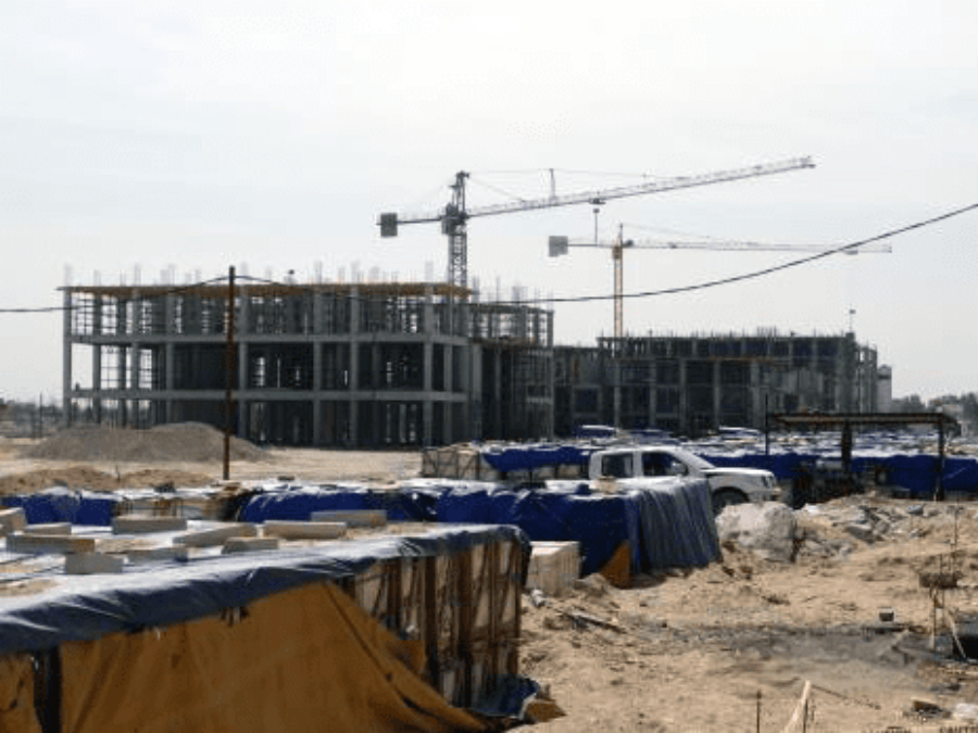 Iraq Rebuild with Cranes and Materials in Laydown Spaces